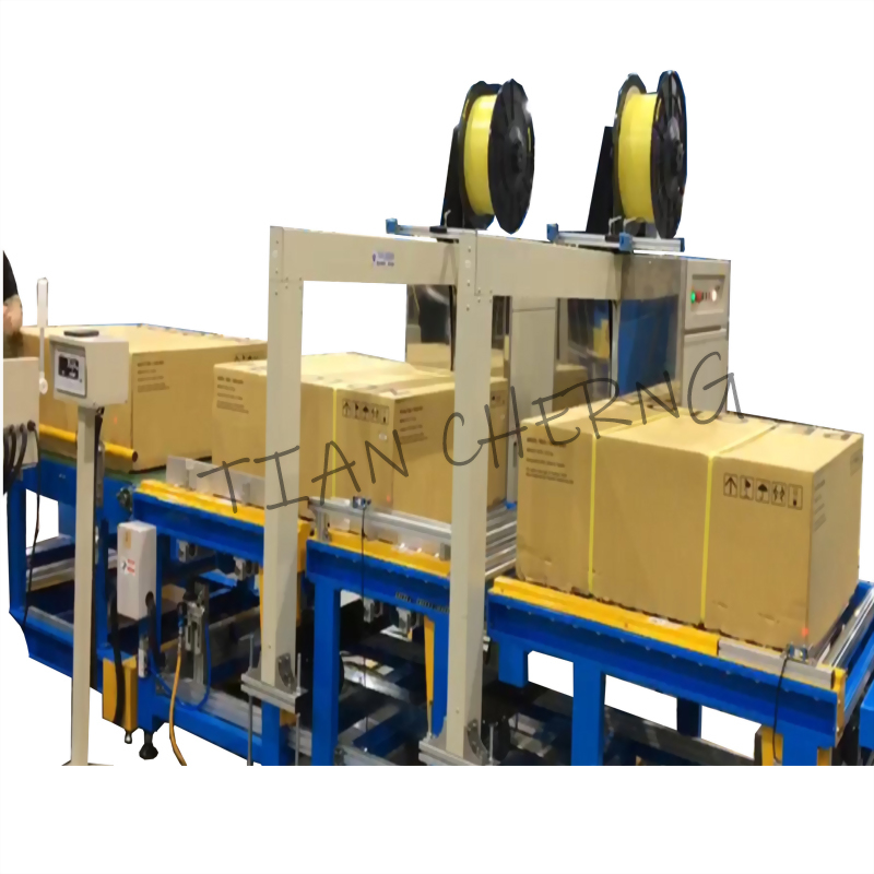 Automated box strapping machine conveyor