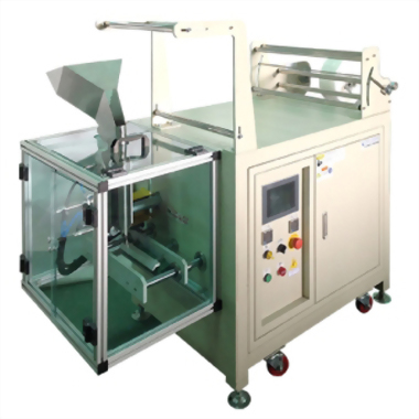 Automatic packaging machine with hopper and film roll