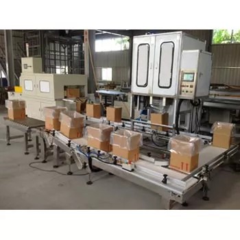 The TC-2100 integrated into a factory conveyor belt system for automated packaging.