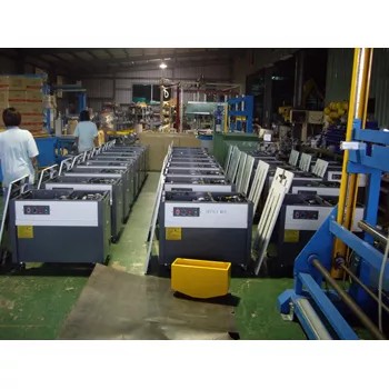 Factory floor with rows of packaging machinery