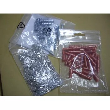 Various hardware items neatly packaged in clear plastic bags by the TC-920 sealing machine.