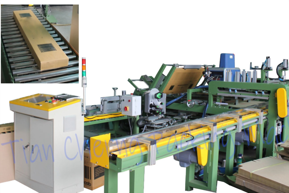 A green and yellow industrial machine for processing cardboard, featuring a control panel, conveyors, and an inset of a finished box on rollers.