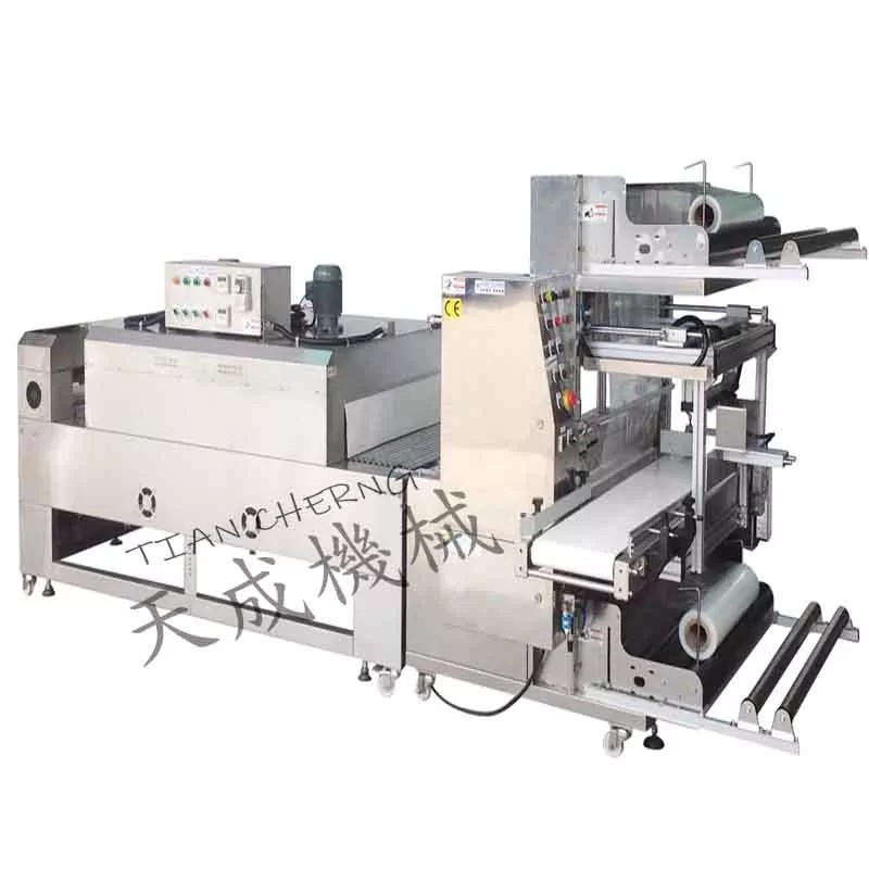 Detailed view of the TC-703 sleeve wrapper's control panel and infeed conveyor