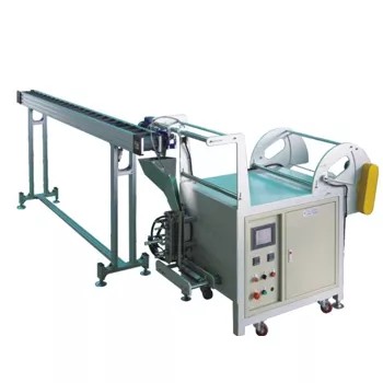 TC-940 machine detail showing the film roll holder and forming mechanism