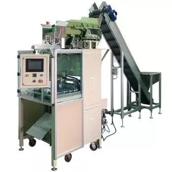 Detailed view of the TC-951's conveyor belt and filling mechanism