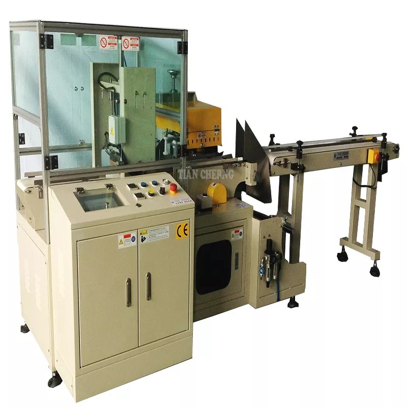 Detailed view of the TC-709 sealing mechanism and conveyor belt