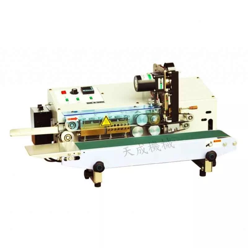 Side view of the TC-62 tabletop sealing machine with its conveyor belt.