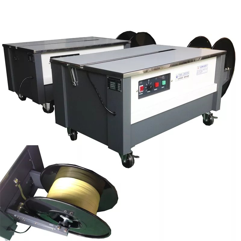 Detailed side view of the TC-302A low-table strapping machine.