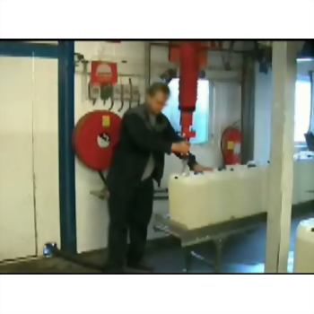 Man operating industrial tank red pump