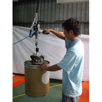Man operating vacuum drum lifter