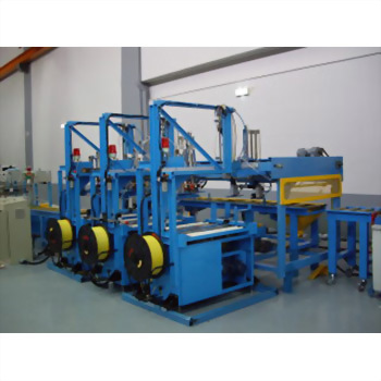A large blue industrial automation machine with multiple stations and yellow spools of material is displayed in a clean factory environment.