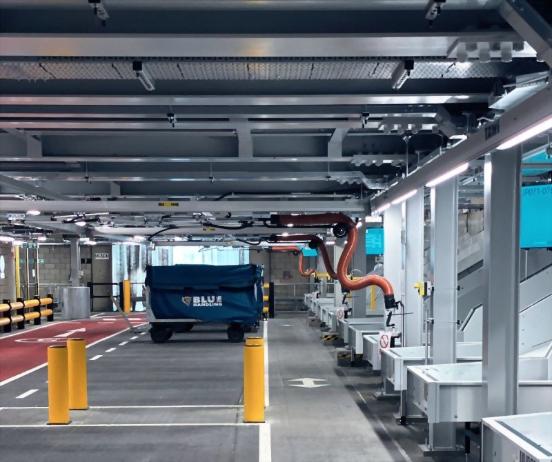 Modern logistics facility blue handling cart sorting automation