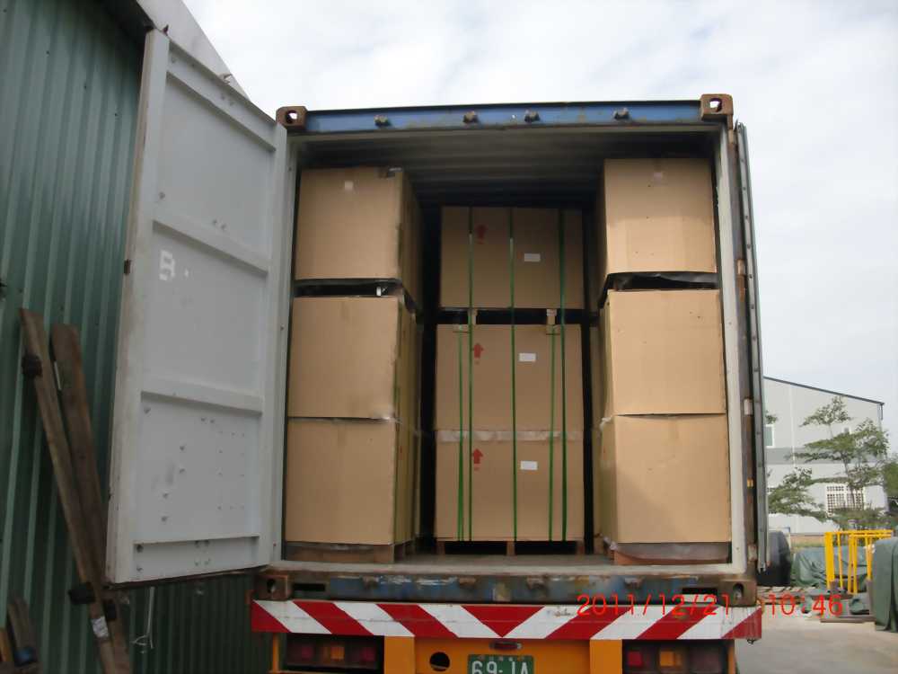 Shipping container loaded cardboard boxes truck logistics